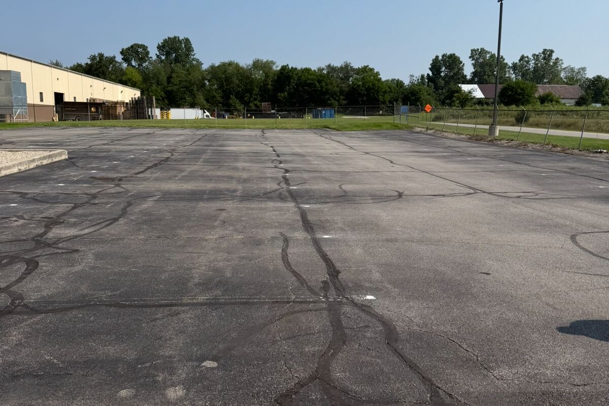 Old failing driveway in Hancock County before replacement