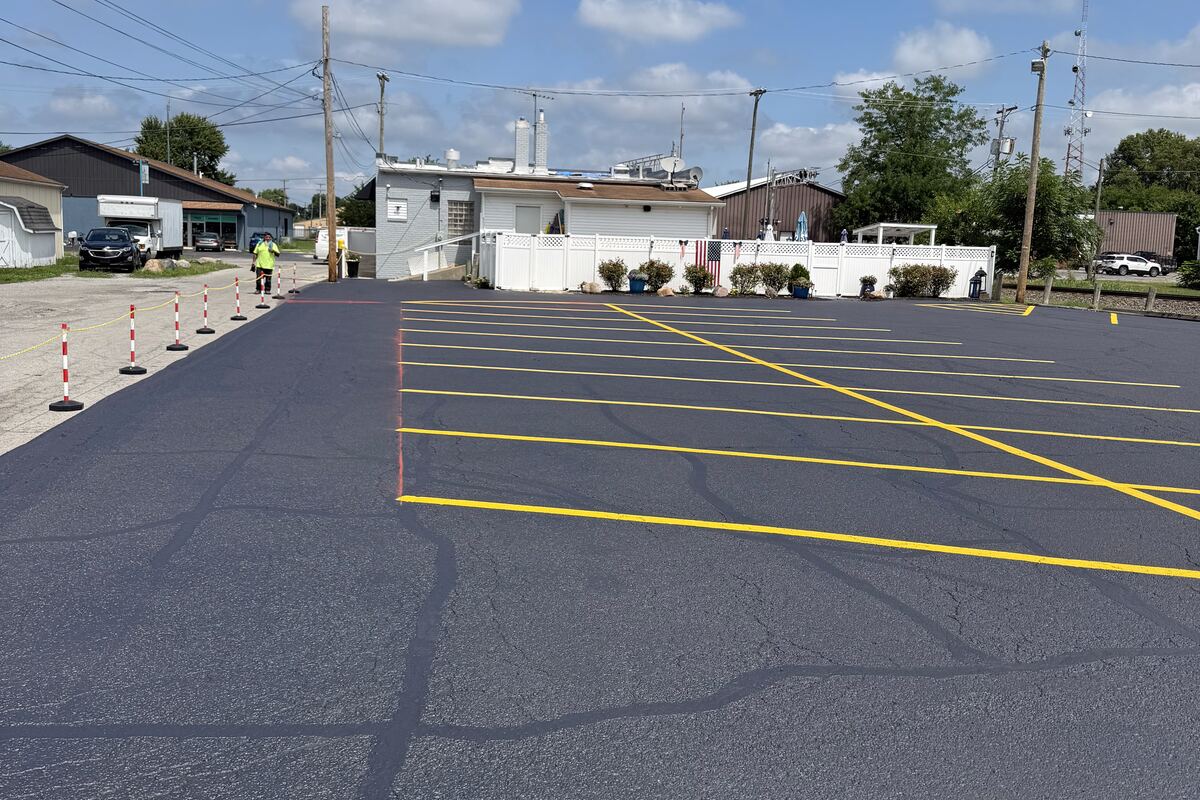 Sealcoated commercial parking lot with fresh striping in Findlay, Ohio